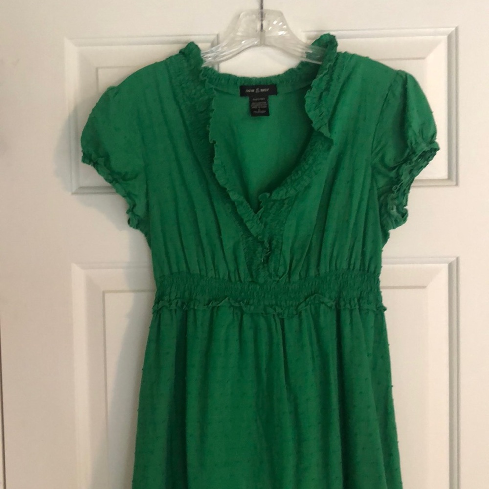 Sweet ruffled green summer dress with high waist and capped sleeves.